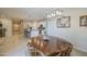 Open dining area with seating, flowing into the kitchen and living spaces at 33974 N Beeblossom Trl, San Tan Valley, AZ 85144