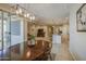 Bright dining area that flows into the living room and kitchen at 33974 N Beeblossom Trl, San Tan Valley, AZ 85144