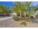 Lovely single-story home featuring desert landscaping, a two-car garage, and a charming facade at 33974 N Beeblossom Trl, San Tan Valley, AZ 85144