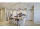 Bright open kitchen with an island, stainless steel appliances, and a stylish backsplash at 33974 N Beeblossom Trl, San Tan Valley, AZ 85144
