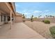 Low-maintenance backyard with a covered patio, desert landscaping, and a peaceful outdoor seating area at 3973 N 160Th Ave, Goodyear, AZ 85395