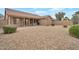 Expansive backyard with low-maintenance desert landscaping, a covered patio, and a peaceful outdoor setting at 3973 N 160Th Ave, Goodyear, AZ 85395