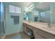 Well-lit bathroom features a double vanity with ample counter space, a large mirror, and a walk-in shower at 3973 N 160Th Ave, Goodyear, AZ 85395