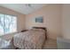 Inviting bedroom with a comfortable bed, a large window, soft lighting, and a peaceful ambiance at 3973 N 160Th Ave, Goodyear, AZ 85395