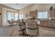Open floor plan with dining area, a breakfast bar, and neutral color palettes at 3973 N 160Th Ave, Goodyear, AZ 85395
