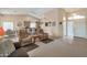 Open-concept living room with vaulted ceilings, neutral tones, and plenty of natural light at 3973 N 160Th Ave, Goodyear, AZ 85395