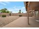 Covered patio and desert rock landscaping provide a relaxing outdoor space at 3973 N 160Th Ave, Goodyear, AZ 85395