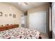 Comfortable bedroom featuring carpet, neutral paint, ceiling fan and a closet with sliding doors at 462 S Marie Dr, Chandler, AZ 85225