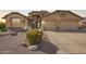 Charming single-story home featuring a well-manicured yard and a spacious two-car garage at 462 S Marie Dr, Chandler, AZ 85225