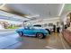 Spacious 3-car garage featuring polished floors, modern cars, and ample storage at 462 S Marie Dr, Chandler, AZ 85225