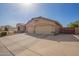 Spacious two-car garage with extended driveway and side access, nestled in a well-maintained community at 462 S Marie Dr, Chandler, AZ 85225