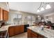 Bright and functional kitchen with granite countertops, matching appliances, and open layout to the living space at 462 S Marie Dr, Chandler, AZ 85225