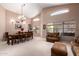 Spacious open-concept living room with vaulted ceilings, large windows, and neutral tones for versatile decorating at 462 S Marie Dr, Chandler, AZ 85225