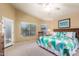 Bright main bedroom with en-suite bath access, ceiling fan, and private patio door at 462 S Marie Dr, Chandler, AZ 85225