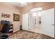 Spacious office with ceiling fan, neutral walls, doorway to hall, and patterned accent rug at 462 S Marie Dr, Chandler, AZ 85225