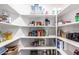 Well-organized pantry with corner shelving stocked with food and household items at 462 S Marie Dr, Chandler, AZ 85225