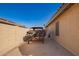 Side yard with a car restoration project underway, with wall for privacy at 462 S Marie Dr, Chandler, AZ 85225