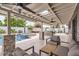 Beautiful backyard featuring a covered patio, inviting pool, spa, lush landscaping, and lounge area at 5605 N 19Th St, Phoenix, AZ 85016