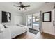 Bright bedroom featuring a ceiling fan, closet, mirror, and a sliding glass door with pool views at 5605 N 19Th St, Phoenix, AZ 85016