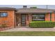 Close-up of front door and manicured landscaping enhance this brick home's curb appeal at 5605 N 19Th St, Phoenix, AZ 85016