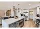 Modern kitchen with stainless steel appliances and a stylish island with barstool seating at 5605 N 19Th St, Phoenix, AZ 85016