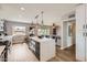 Bright, open kitchen with stainless appliances and island seating connects to living spaces at 5605 N 19Th St, Phoenix, AZ 85016