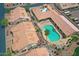 Community pool and green spaces, surrounded by residential buildings with tile roofs and desert landscaping at 5830 E Mckellips Rd # 30, Mesa, AZ 85215