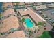 Community pool and green spaces, surrounded by residential buildings with tile roofs and desert landscaping at 5830 E Mckellips Rd # 30, Mesa, AZ 85215