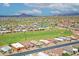 Expansive aerial view of a residential community with lush golf course, scenic mountains, and desert landscape at 5830 E Mckellips Rd # 30, Mesa, AZ 85215
