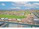 Expansive aerial view of a residential community with lush golf course, scenic mountains, and desert landscape at 5830 E Mckellips Rd # 30, Mesa, AZ 85215