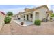 Spacious backyard featuring low-maintenance desert landscaping and a covered patio at 5830 E Mckellips Rd # 30, Mesa, AZ 85215