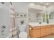 Bright bathroom features a single sink vanity and shower-tub combination at 5830 E Mckellips Rd # 30, Mesa, AZ 85215