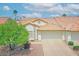 Charming single-story home featuring a tile roof, two-car garage, and low-maintenance desert landscaping at 5830 E Mckellips Rd # 30, Mesa, AZ 85215