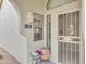 Inviting front entrance with secure screen door, house number and decorative flower pots at 5830 E Mckellips Rd # 30, Mesa, AZ 85215