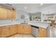 Contemporary kitchen boasts light wood cabinets, stainless steel appliances, and quartz counters at 5830 E Mckellips Rd # 30, Mesa, AZ 85215