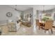 Open concept living area features dining room, ceiling fan, and stylish furniture at 5830 E Mckellips Rd # 30, Mesa, AZ 85215