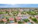 A wide aerial showcases a neighborhood with diverse houses and lush greenery highlighting community charm and tranquil living at 6019 E Paradise Ln, Scottsdale, AZ 85254