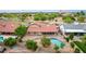 Aerial view of backyard with pool and patio with a red tiled roof at 6019 E Paradise Ln, Scottsdale, AZ 85254