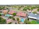 Expansive aerial view of home with refreshing pool, covered patio, and lush surroundings in a desirable neighborhood at 6019 E Paradise Ln, Scottsdale, AZ 85254