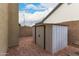 Backyard shed on a brick patio with a block fence at 6019 E Paradise Ln, Scottsdale, AZ 85254