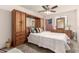 Carpeted bedroom with a ceiling fan and wardrobe featuring mirrored panels at 6019 E Paradise Ln, Scottsdale, AZ 85254