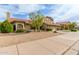 Charming home with a red tile roof, lush landscaping, and ample curb appeal at 6019 E Paradise Ln, Scottsdale, AZ 85254