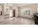 Entryway with tiled floors, light fixture, and a front window with shutters at 6019 E Paradise Ln, Scottsdale, AZ 85254
