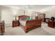Spacious main bedroom featuring a ceiling fan, natural light, and decorative wooden furnishings at 6019 E Paradise Ln, Scottsdale, AZ 85254