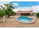 Backyard view with a sparkling private pool and spacious patio area at 6019 E Paradise Ln, Scottsdale, AZ 85254
