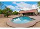 Large backyard with a sparkling pool and ample space for outdoor activities at 6019 E Paradise Ln, Scottsdale, AZ 85254