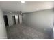 Spacious bedroom features plush gray carpet, recessed lighting, fan, and closet at 6041 W Golden Ln, Glendale, AZ 85302