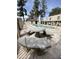 Community pool area with concrete picnic table and seating, surrounded by trees and fencing at 6041 W Golden Ln, Glendale, AZ 85302