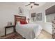 Cozy bedroom featuring a comfortable bed, soft lighting, and a large window view at 6202 E Mckellips Rd # 189, Mesa, AZ 85215