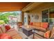 Comfortable covered patio with stylish seating, a fire pit, and views of the manicured outdoor dining area at 6202 E Mckellips Rd # 189, Mesa, AZ 85215